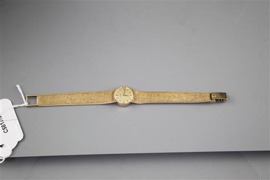 A ladys 1960s? 9ct gold Omega manual wind wristwatch, on integral textured 9ct gold Omega bracelet, gross weight 23.2 grams.